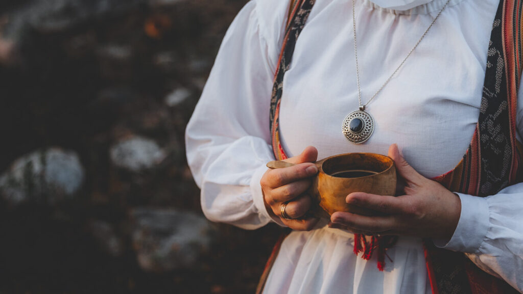 National costume and Uskela pendant.