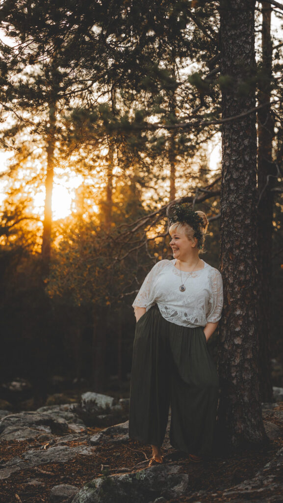Contact local singer-performer standing at the Rovaniemi forest.